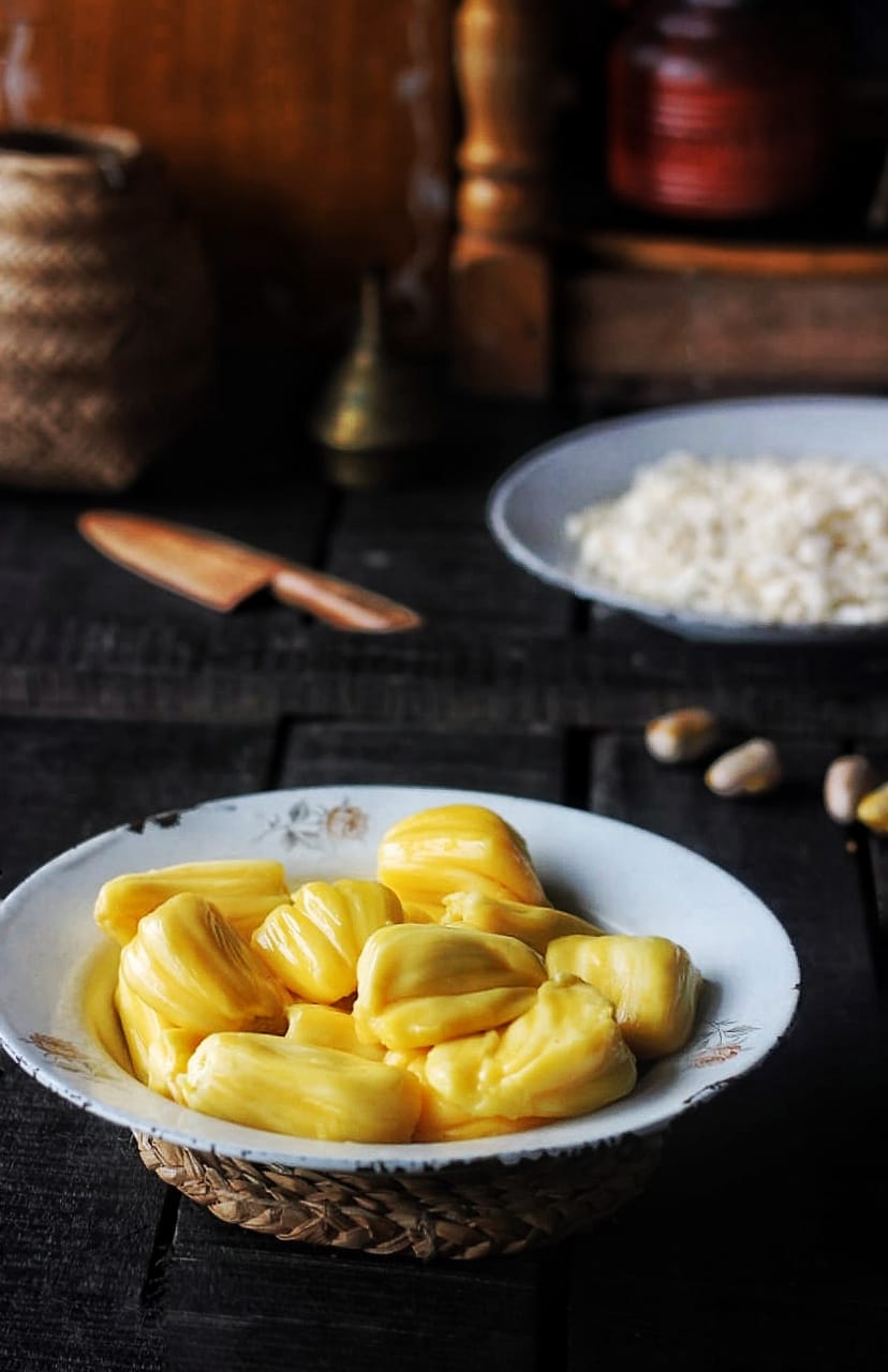 Fresh jackfruit slices on a white plate